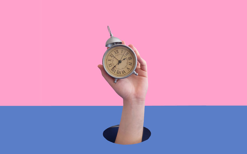 hand holding clock